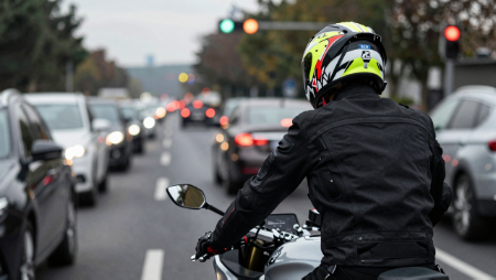 motorcycle rider in heavy traffic generated with Z-Image